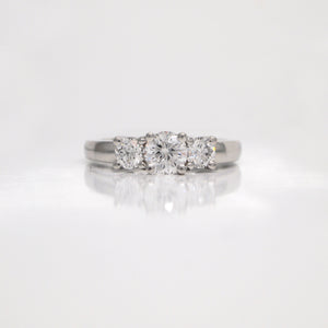Platinum 3-stone diamond engagement ring with diamonds weighing a total of 1.02 carats.