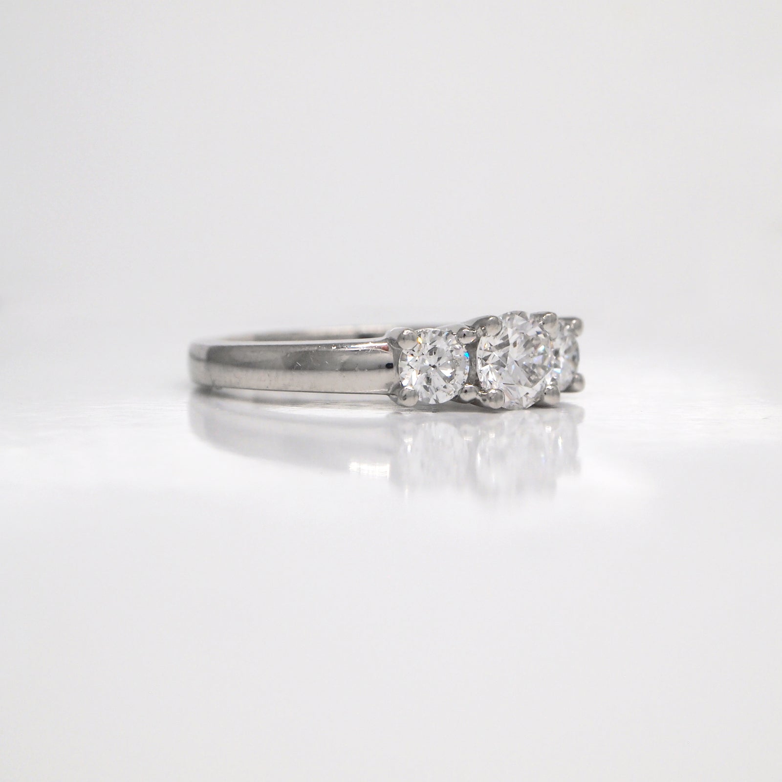 Platinum 3-stone diamond engagement ring with diamonds weighing a total of 1.02 carats.