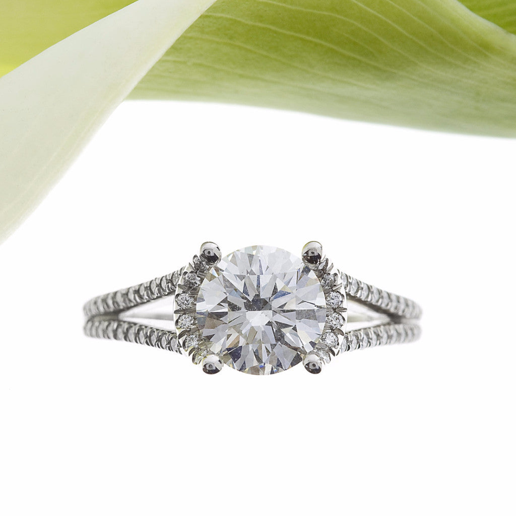 Platinum Halo Split Shank Diamond Engagement Ring With A Round Diamond Centerstone and Round Diamonds