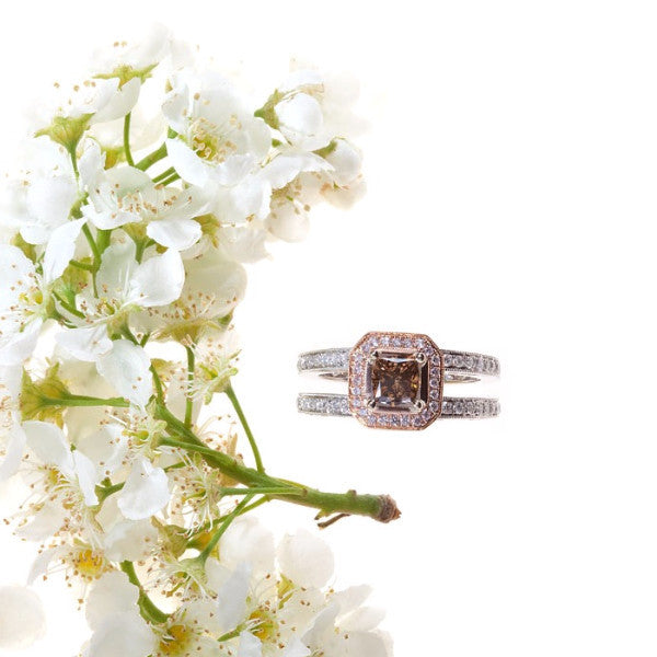 white and rose gold double shank engagement ring with cognac, pink, and white diamonds