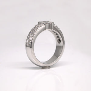 Platinum diamond engagement ring featuring one 0.70 carat oval diamond (SI1, E color), and pave set diamonds weighing a total of 0.75 carats.
