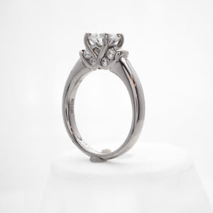 Palladium diamond engagement ring featuring round brilliant diamonds weighing a total of 0.36 carats. 