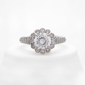 Platinum diamond ring with round brilliant diamonds weighing a total of 0.69 carats. 