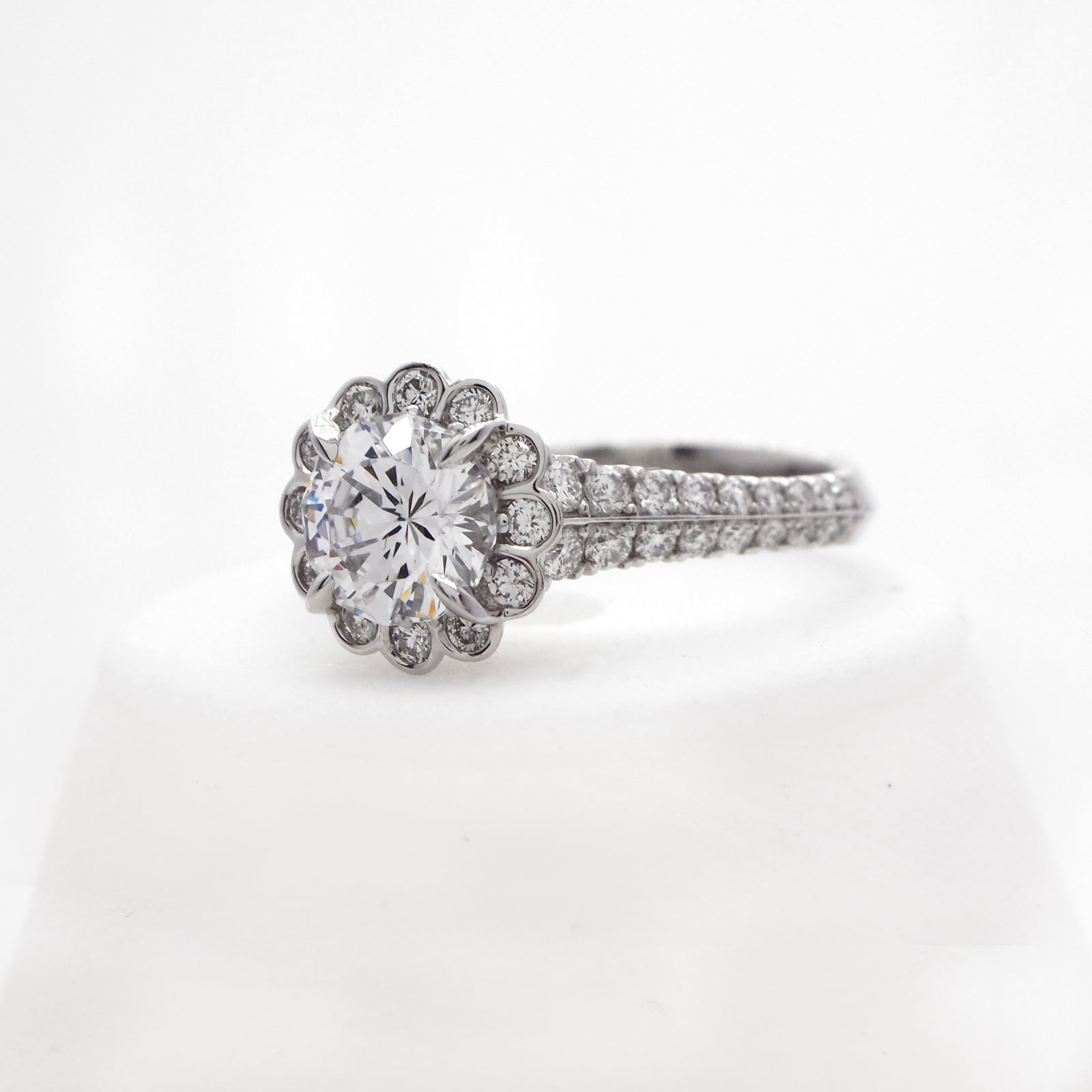 Platinum diamond ring with round brilliant diamonds weighing a total of 0.69 carats. 