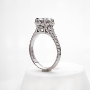 Platinum diamond ring with round brilliant diamonds weighing a total of 0.69 carats. 