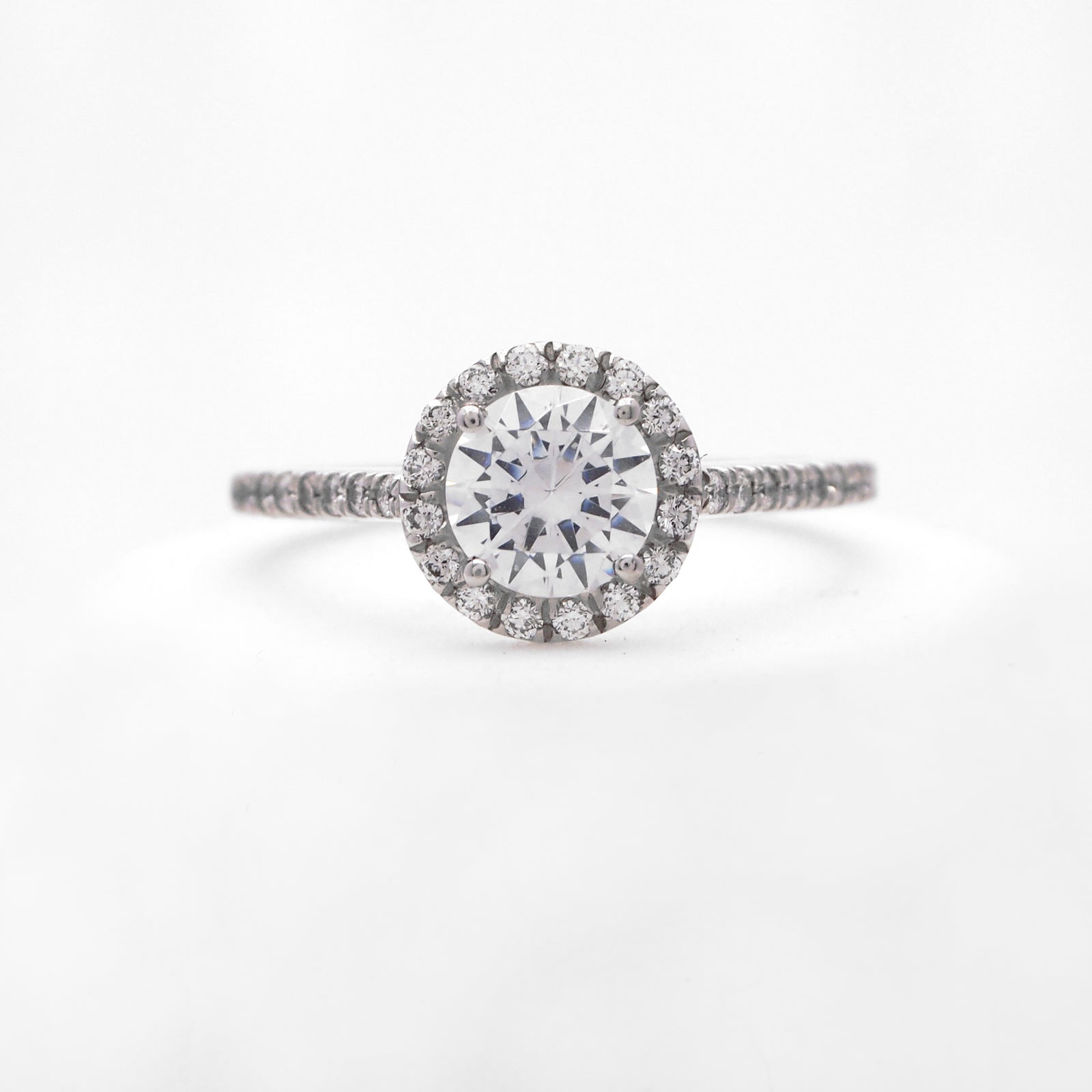 Platinum diamond engagement ring with round brilliant diamonds weighing a total of 0.28 carats. 