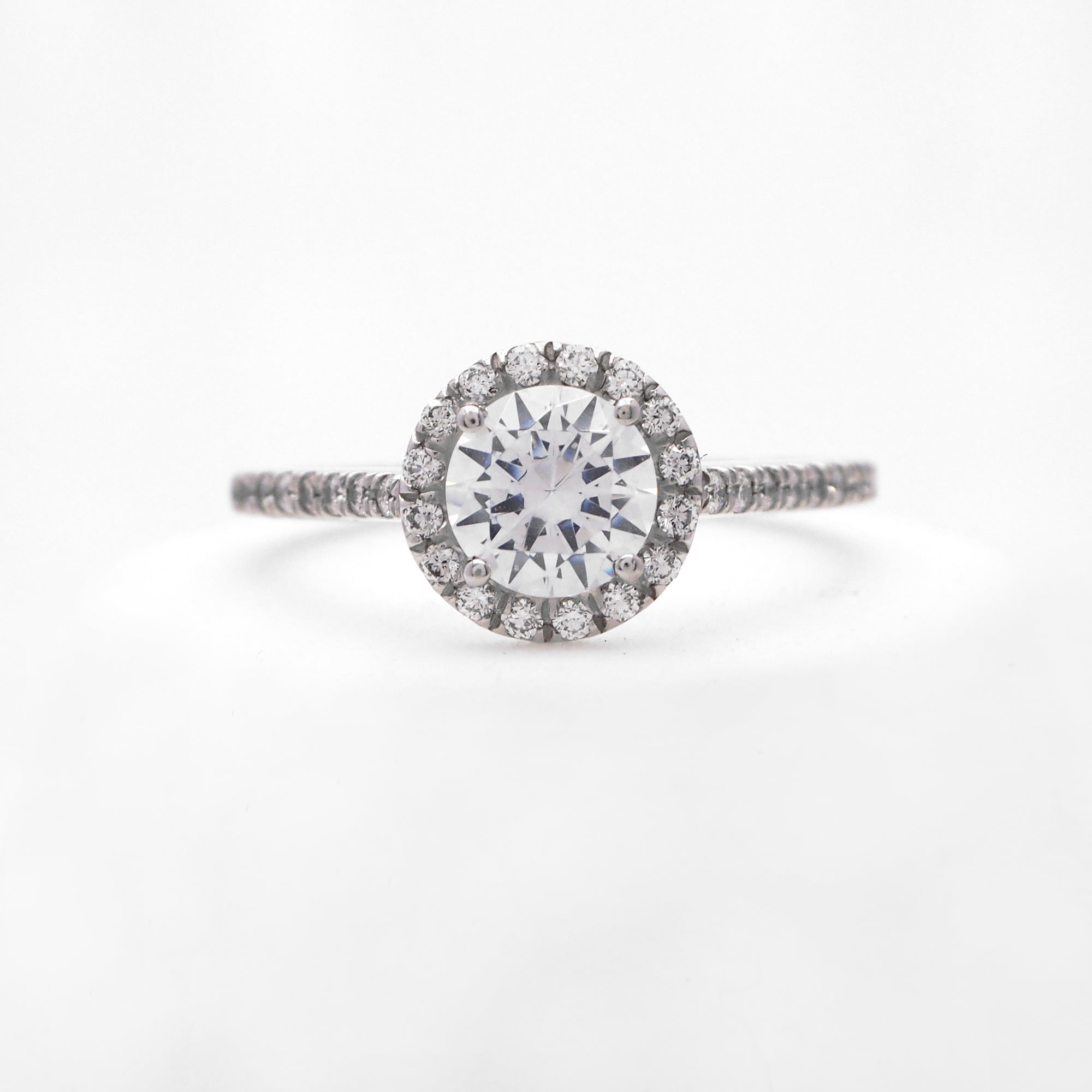 Platinum diamond engagement ring with round brilliant diamonds weighing a total of 0.28 carats. 