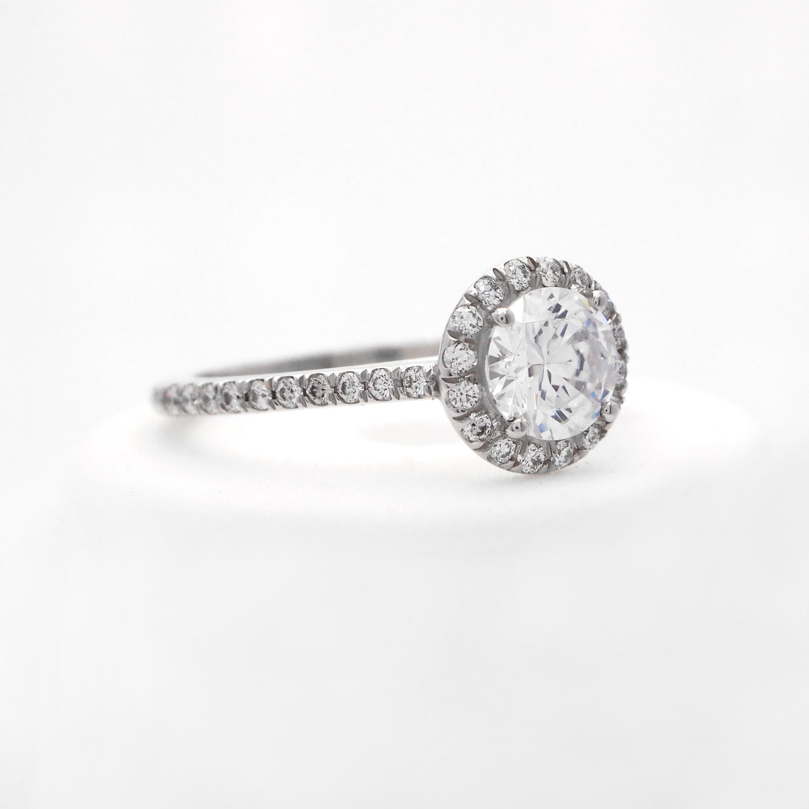 Platinum diamond engagement ring with round brilliant diamonds weighing a total of 0.28 carats. 