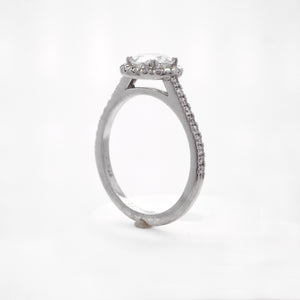 Platinum diamond engagement ring with round brilliant diamonds weighing a total of 0.28 carats. 