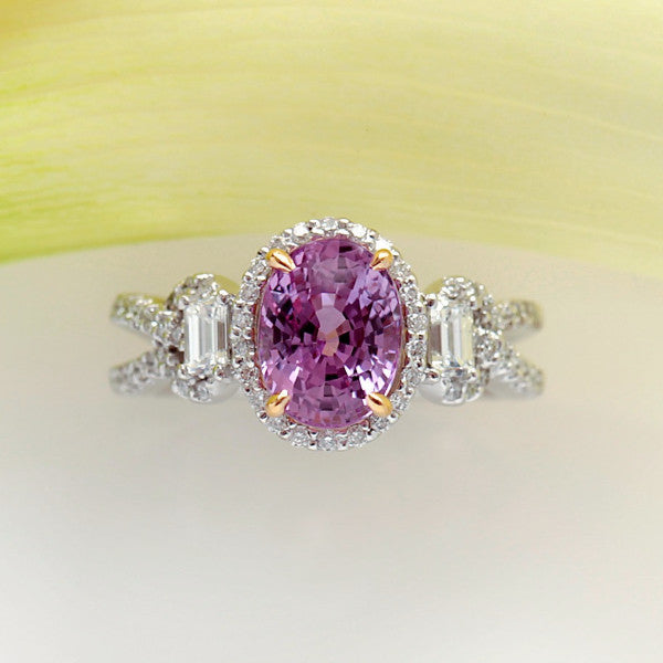 White Gold Ring with One Intense Pink Oval Sapphire in Yellow Gold Prongs, Baguette Diamonds, and Micro Pave Set Diamonds