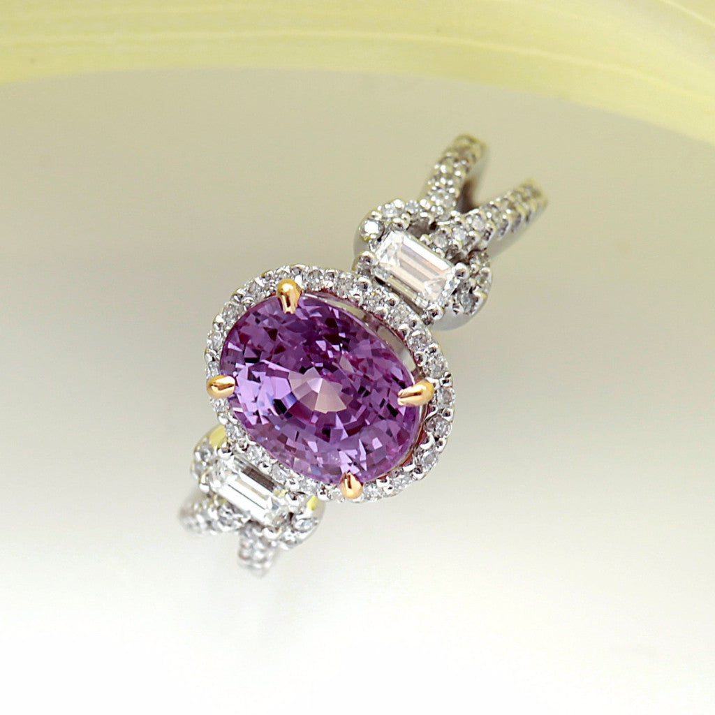 White Gold Ring with One Intense Pink Oval Sapphire in Yellow Gold Prongs, Baguette Diamonds, and Micro Pave Set Diamonds