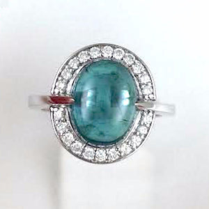 Front facing view of one of a kind blue green tourmaline and diamond ring