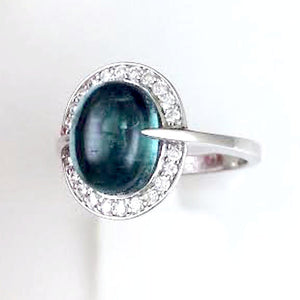 Angled view of one of a kind blue green tourmaline and diamond ring