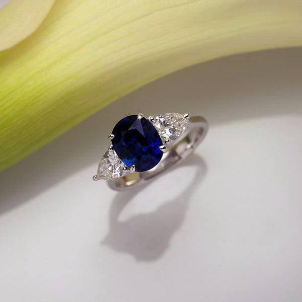 White Gold Three-Stone Ring with One Certified Natural Blue Sapphire and Two Pear Shaped Diamonds