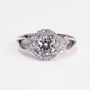 14K white gold semi-mount engagement ring with a halo containing 32 diamonds