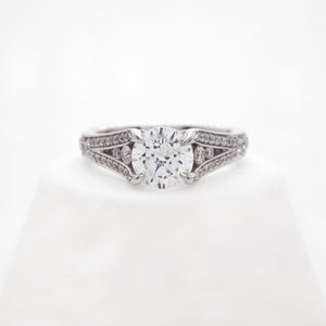 Platinum diamond engagement ring with round brilliant diamonds weighing a total of 0.49 carats.