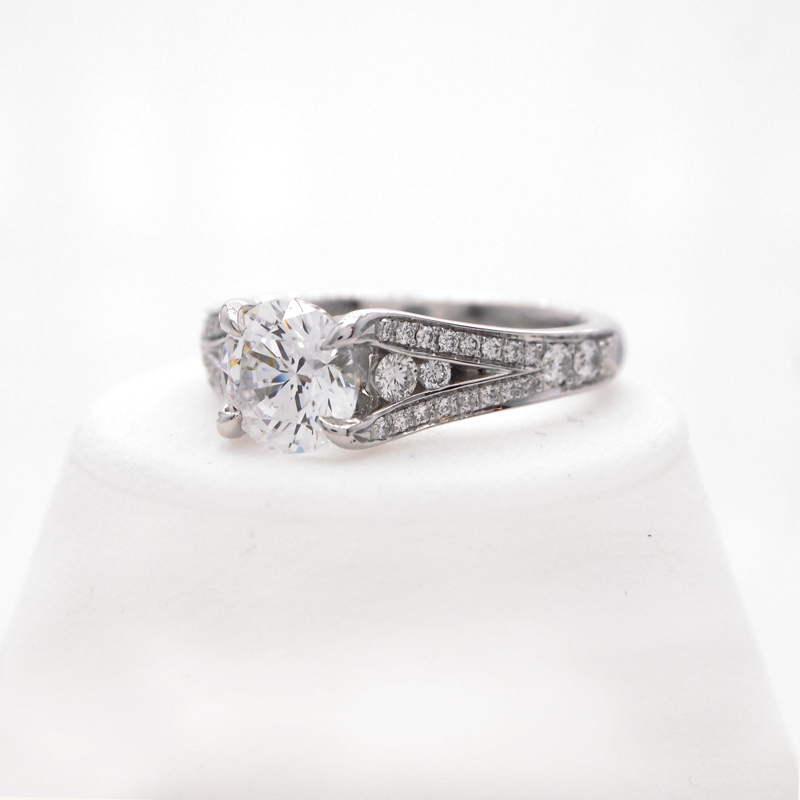 Platinum diamond engagement ring with round brilliant diamonds weighing a total of 0.49 carats.