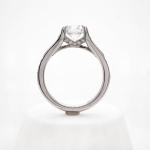 Platinum diamond engagement ring with round brilliant diamonds weighing a total of 0.49 carats.