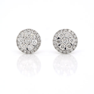 14K white gold diamond earrings featuring round brilliant diamonds weighing a total of 0.50 carats. 