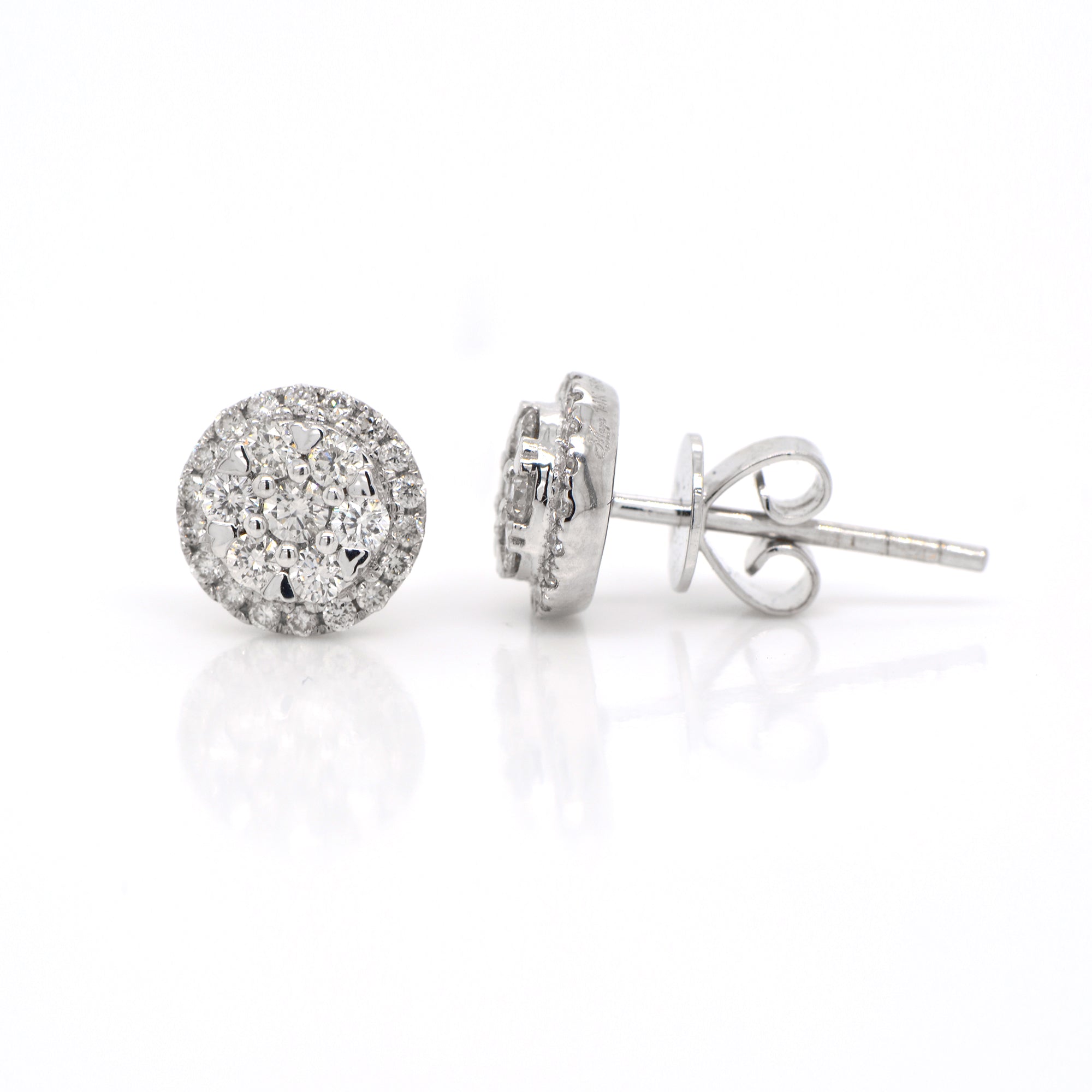 14K white gold diamond earrings featuring round brilliant diamonds weighing a total of 0.50 carats. 