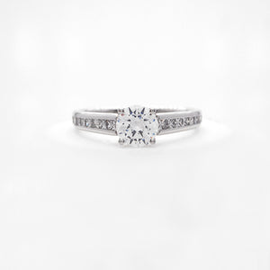 Platinum diamond engagement ring featuring princess cut diamonds weighing a total of 0.47 carats. 