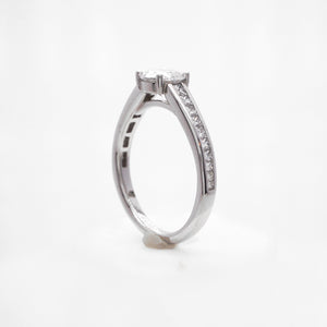 Platinum diamond engagement ring featuring princess cut diamonds weighing a total of 0.47 carats. 