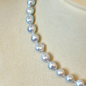Pearl strand necklace featuring silvery-blue baroque pearls (8mm - 9mm) and a 14K rose gold clasp. 
