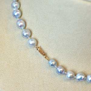 Pearl strand necklace featuring silvery-blue baroque pearls (8mm - 9mm) and a 14K rose gold clasp. 