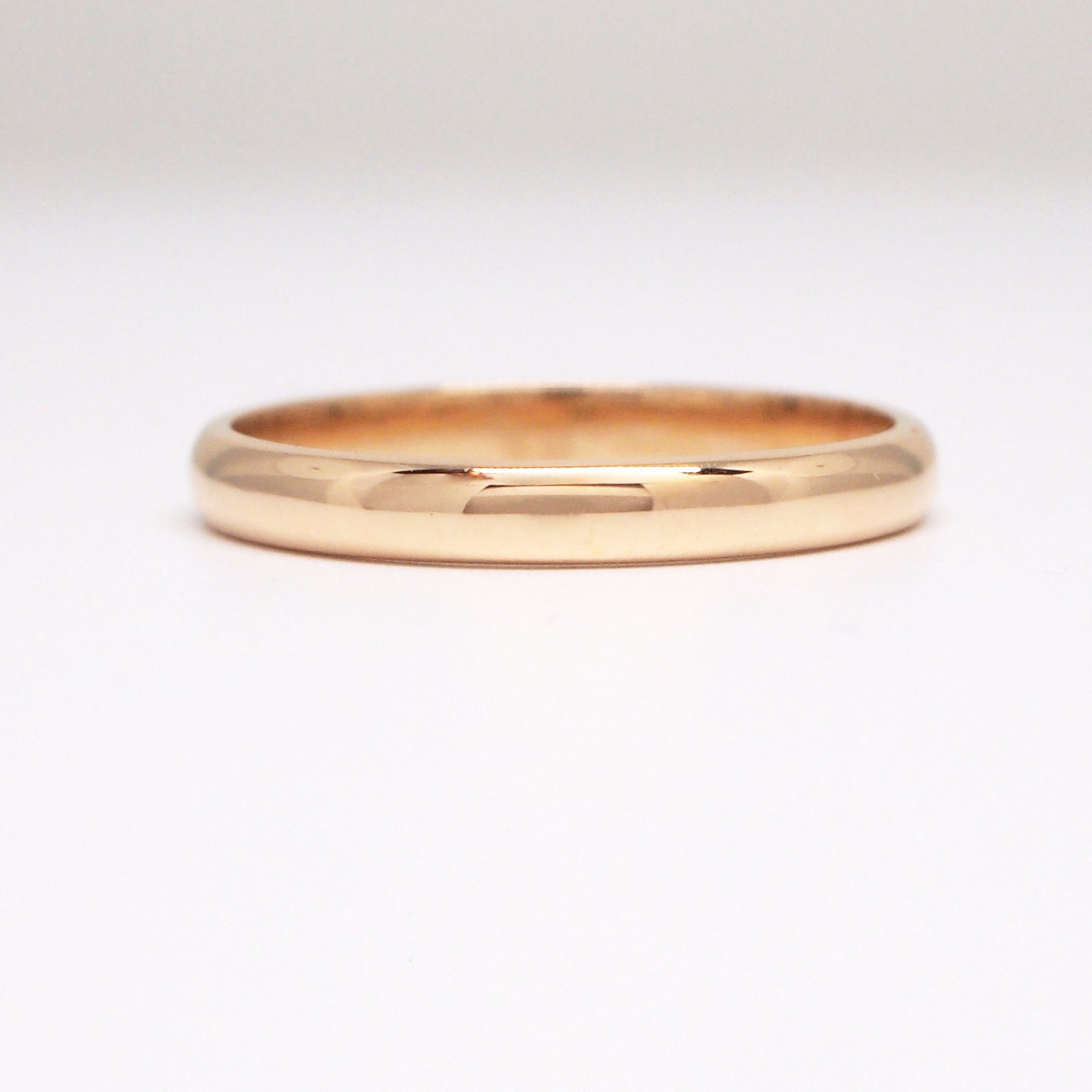 18K yellow gold 2.5mm half round wedding band.