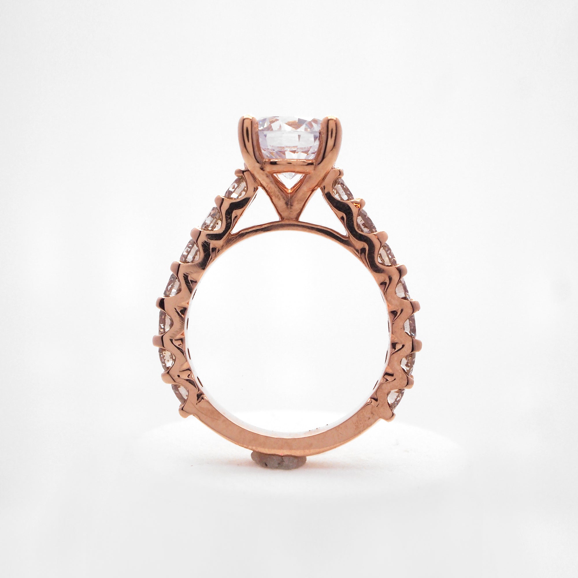 14K rose gold diamond engagement ring with round brilliant diamonds weighing a total of 1.40 carats. 