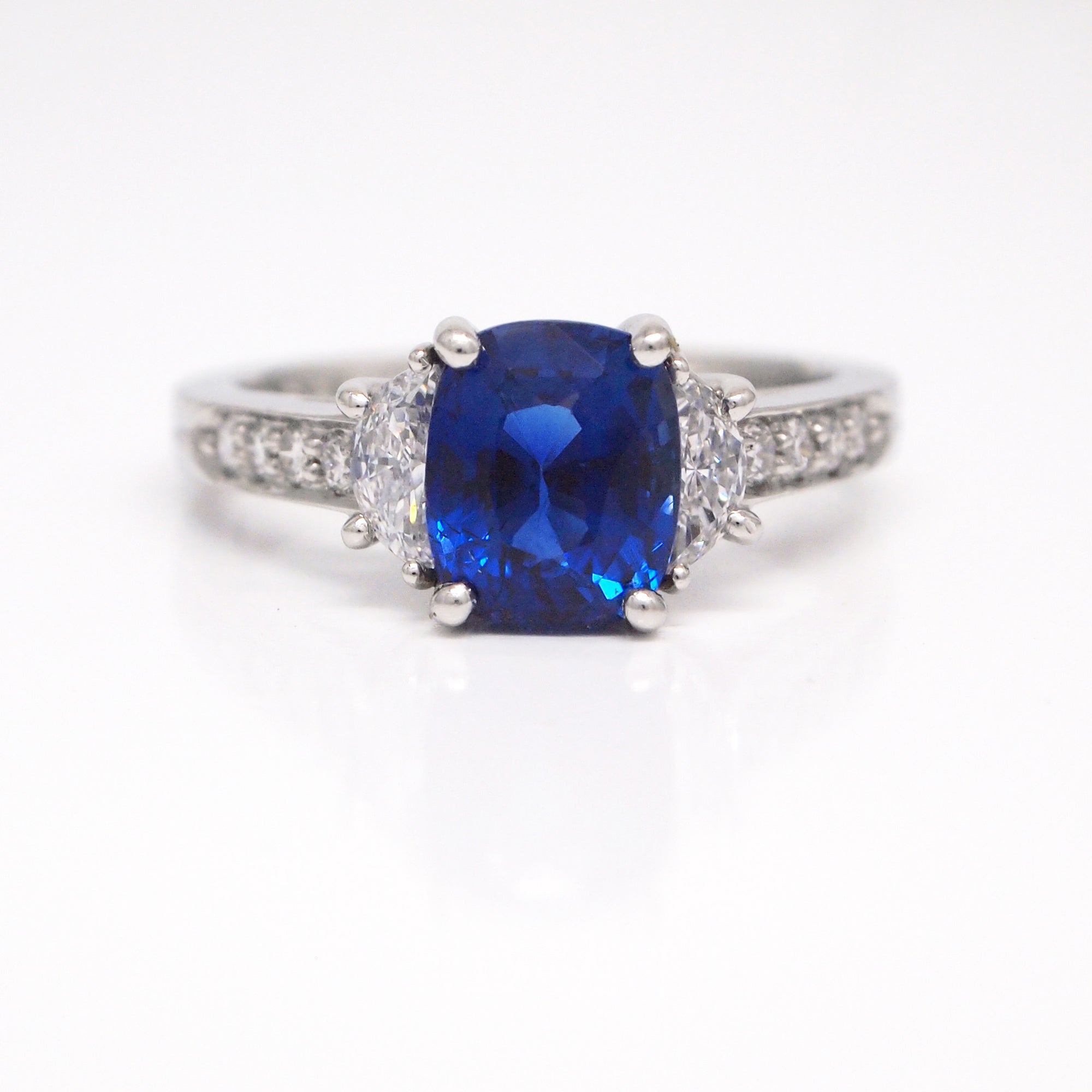 Platinum cushion cut sapphire and diamond engagement ring