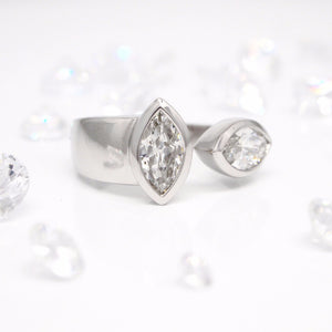Custom designed open-ended marquis diamond ring