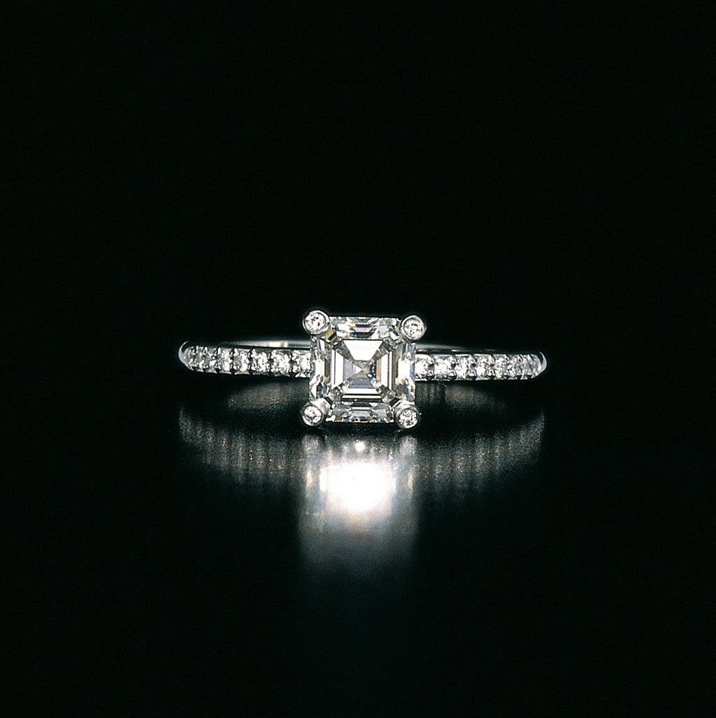 Daniel K platinum rosebud diamond engagement ring with emerald cut and round diamonds