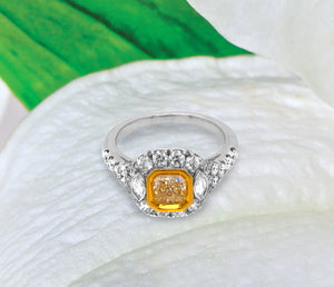 18K white gold diamond engagement ring featuring a 0.74 carat natural fancy yellow diamond bezel set in yellow gold, and marquis round diamonds weighing a total of 0.99 carats. Total diamond weight: 1.73ctw.