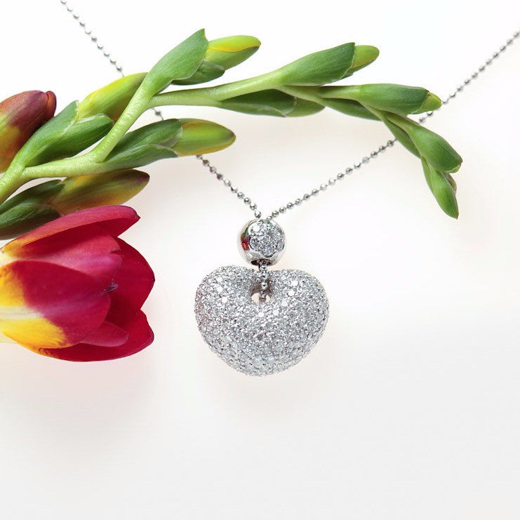 18k white gold puff heart pendant pave set with 152 round brilliant full cut diamonds