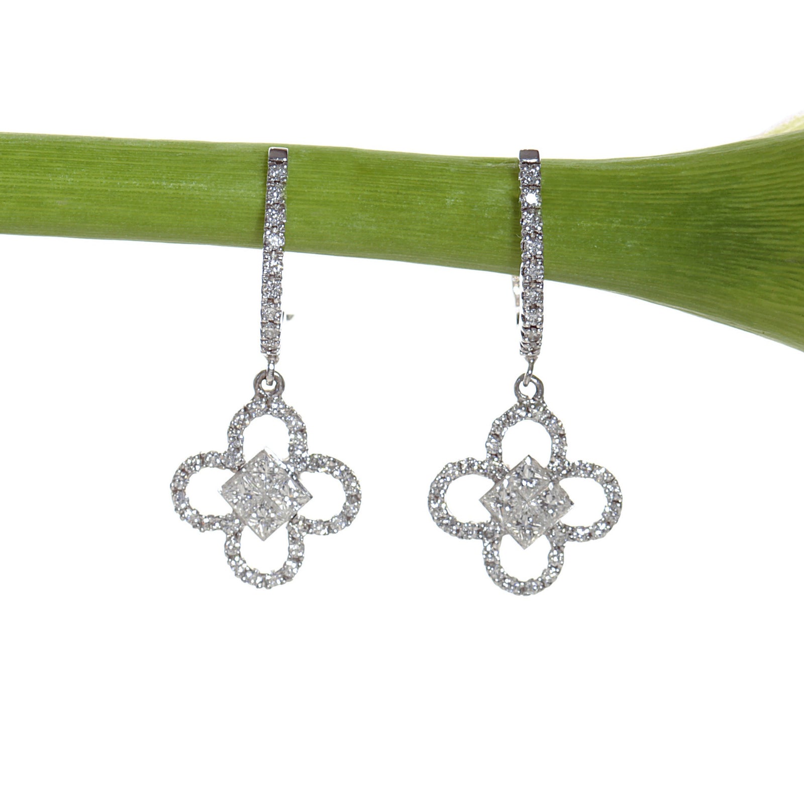 18K white gold clover drop earrings set with princess and round cut diamonds