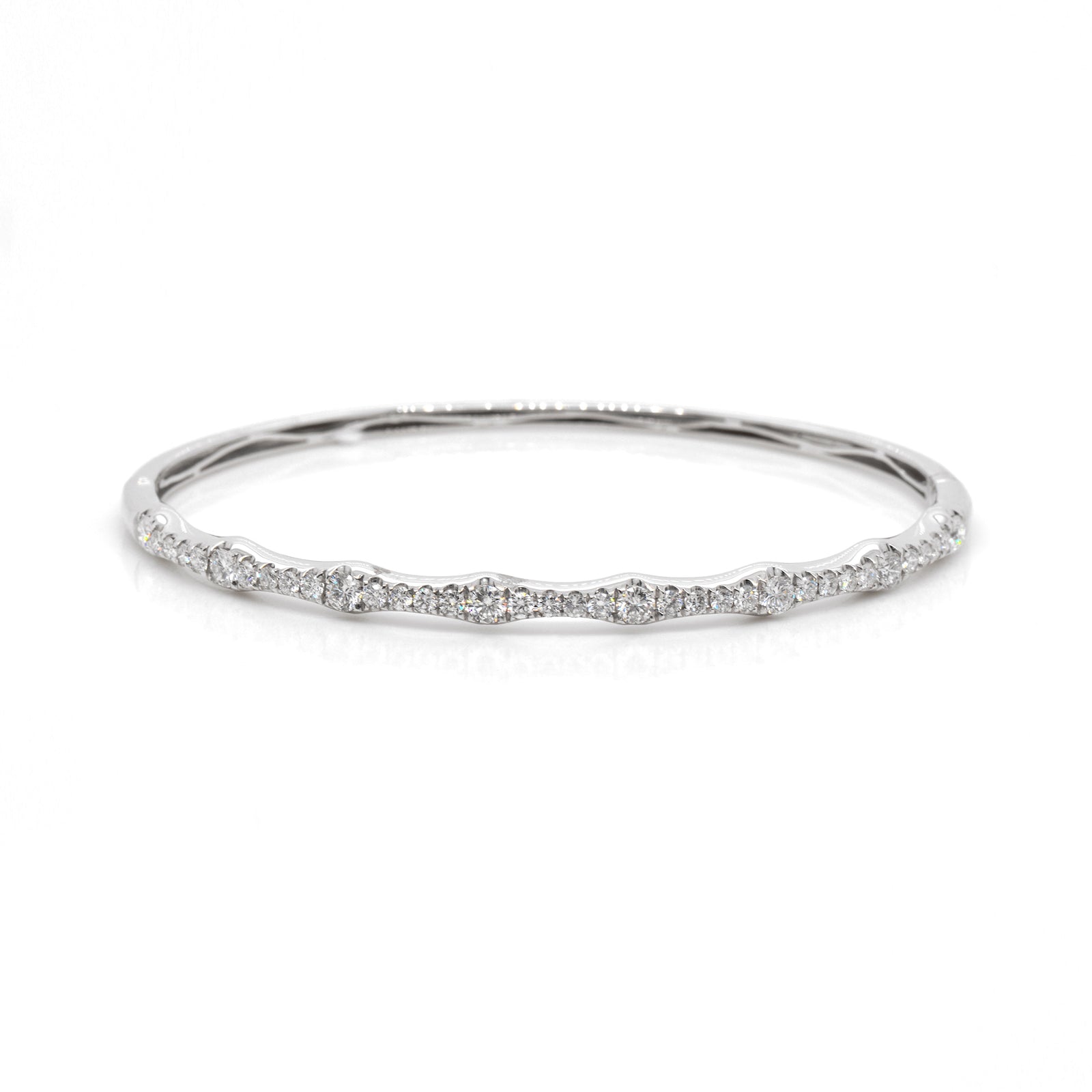 18K white gold diamond bangle featuring round brilliant diamonds