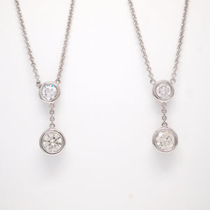 Custom matching necklaces designed with family diamonds