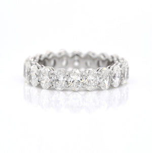 Platinum oval diamond eternity band featuring 20 oval diamonds (F-G color, VS-SI clarity) weighing a total of 4.09 carats.