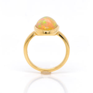 18K yellow gold opal ring featuring one pear-shaped Ethiopian opal weighing 3.52 carats. Judith Arnell Jewelers.