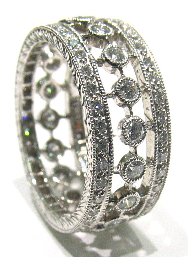 Platinum wedding or anniversary band with round diamonds.