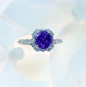 Plaitnum natural, unheated violet sapphire ring with white round brilliant diamonds