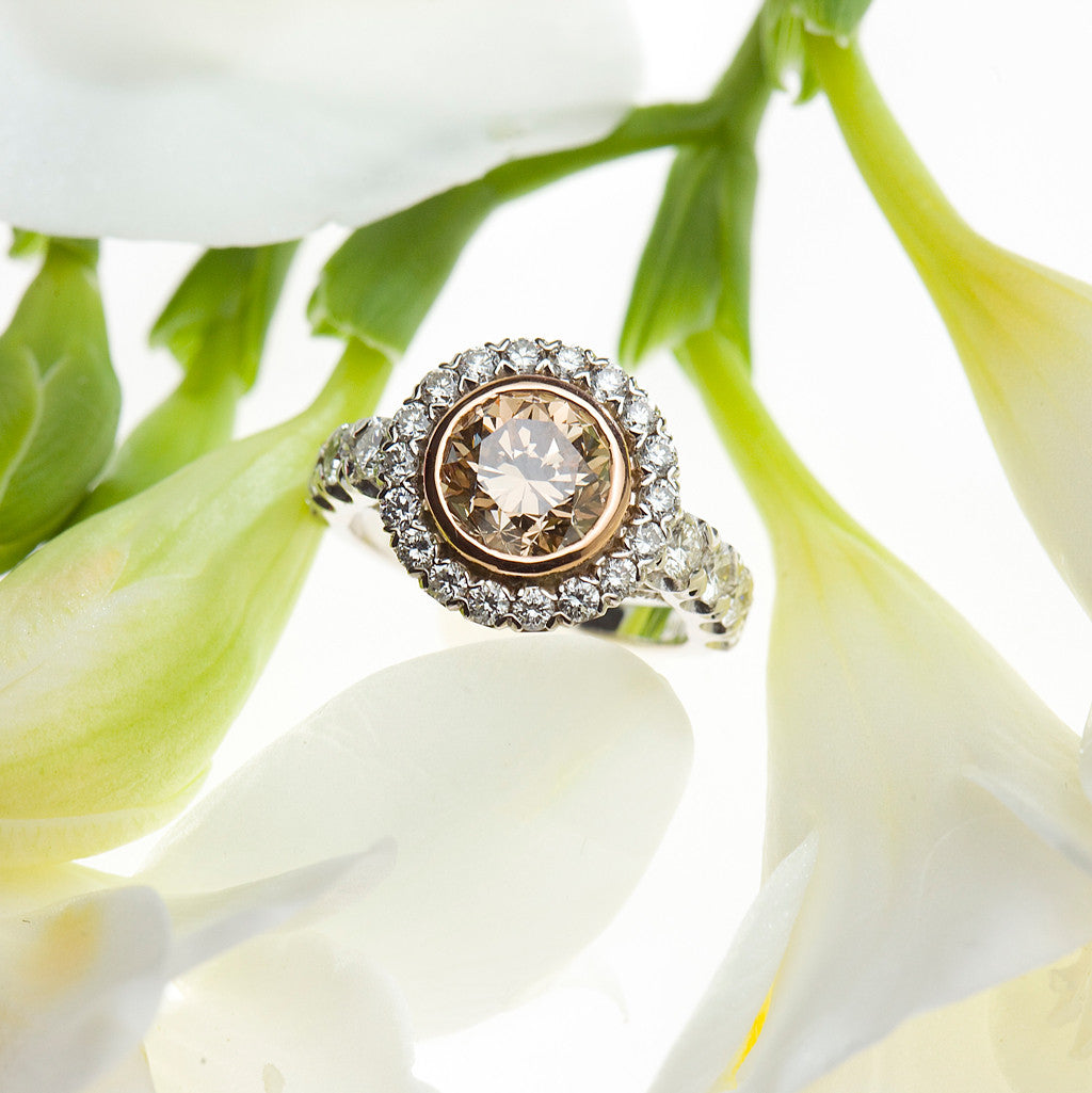 handmade platinum and rose gold ring with a brown pink diamond and white diamonds