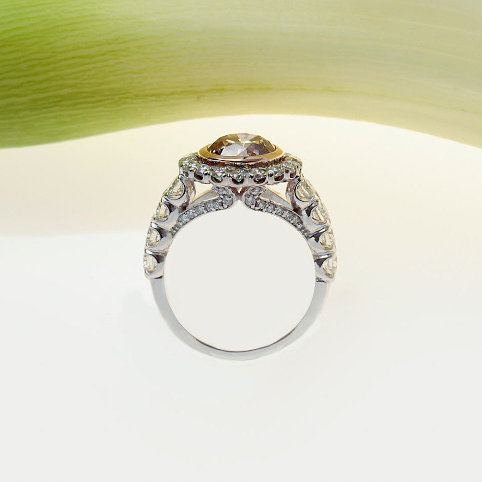 handmade platinum and rose gold ring with a brown pink diamond and white diamonds