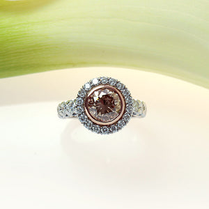 handmade platinum and rose gold ring with a brown pink diamond and white diamonds