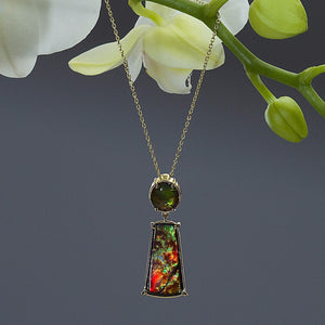 One Of A Kind Ammolite Fossil Pendant on a yellow gold cable link chain
