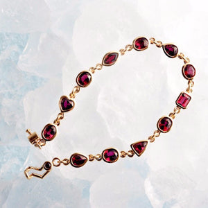 yellow gold bezel set ruby bracelet