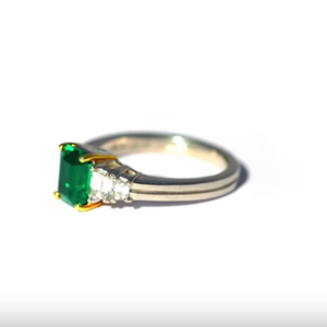 Angled view of Platinum and Yellow Gold Emerald and Diamond Ring